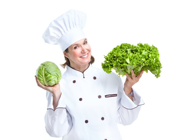 托着蔬菜的女厨师图片
