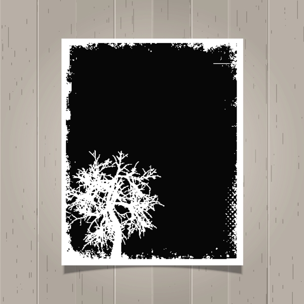 黑色的残破的海报和一棵树
