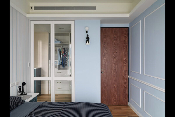 简约卧室蓝色墙壁装修效果图